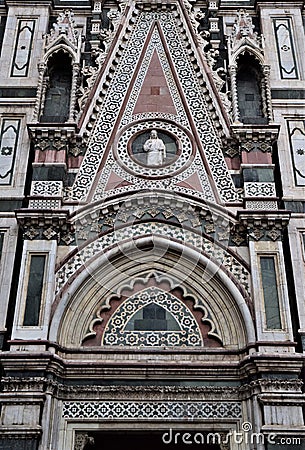 Detail, above a very elaborate door, of the wall of the cathedral Santa Maria del Fiore in Florence. Stock Photo