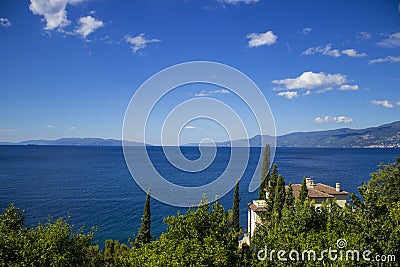 Detail of the Adriatic Sea with mountains, trees and holiday home. Stock Photo
