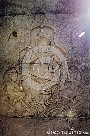 Detail of apsara dancers carved at the Angkor Wat complex in Cambodia. Stock Photo