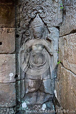 Detail of apsara dancers carved at the Angkor Wat complex in Cambodia. Stock Photo