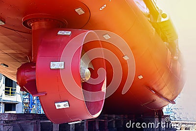 Propeller at stern ship with sunset in shipyard. Stock Photo