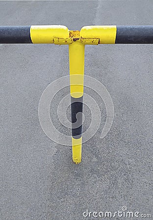 Detail of black and yellow metal security barrier. Fixed gate barrier. Beaconing and signaling concept. Roadblock Road Barrier Stock Photo