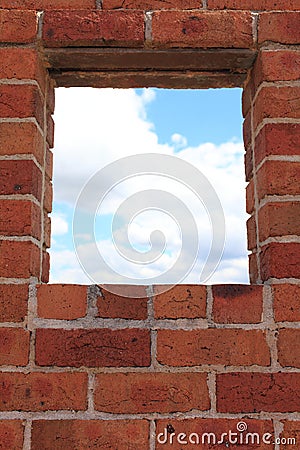 Window in red brick wall view to sky Stock Photo