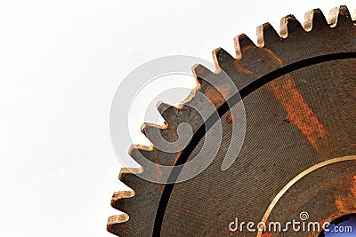 Broken old and rusty gear on white paper background Stock Photo