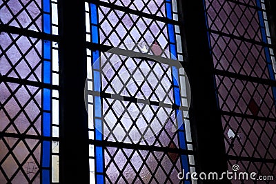 Detail of a broken stained glass window in Crowland Abbey, Crowland, Lincolnshire, England - 27th April 2013 Editorial Stock Photo