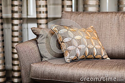 Detail of brown pillow on the brown sofa Stock Photo