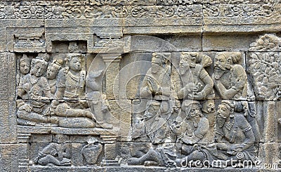 Detail of Buddhist carved relief in Borobudur temple. Stock Photo