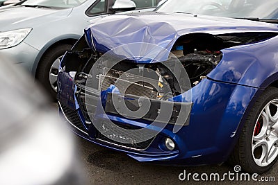 Detail Of Car Damaged In Motor Vehicle Accident Parked In Garage Repair Shop Stock Photo