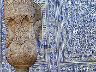 Wood decorated column of an ancient madrasah of Khiva in Uzbekistan. Editorial Stock Photo
