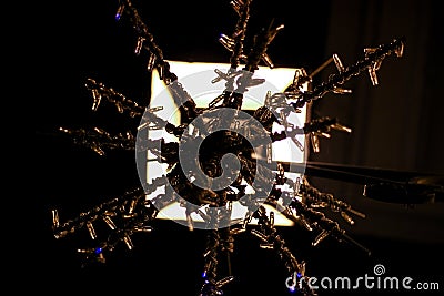 Detail Christmas snowflake decoration with street lamp lights. Stock Photo