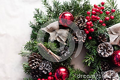Detail of Christmas wreath with red baubles and berries Stock Photo