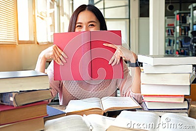 Young woman studying in library Stock Photo