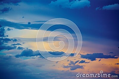 Detail of clouds by sunset sunrise with blue and gold color Stock Photo