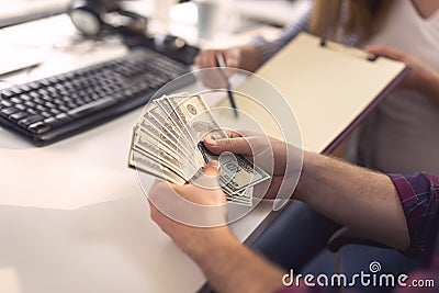 Corrupted businessman counting money Stock Photo