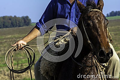 Detail of a cowboy with the lasso in his hand. Stock Photo