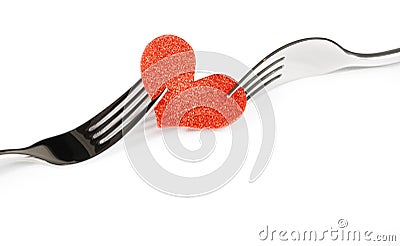 Detail of decorative red heart near forks on white background, valentine day dinner on white background Stock Photo