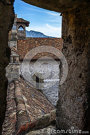 Detail of the defense walls, roofs and towers of the medieval Ca Editorial Stock Photo