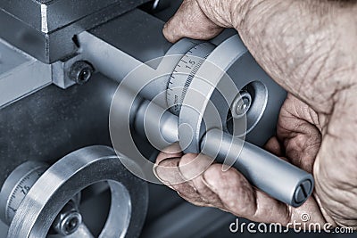 Close-up of control wheels of feed on a machine tool Stock Photo