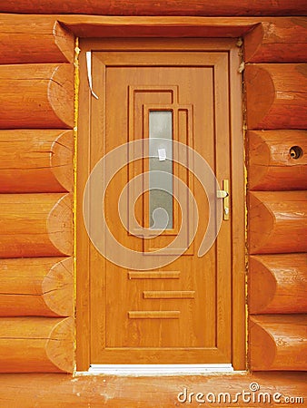 Detail of doors build in wooden beams cabin wall. Stock Photo