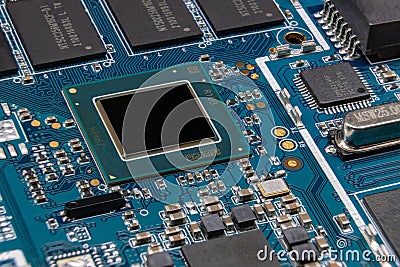 Detail of electronic board of computer. Close-up of electronic circuit board with processor, chipset, microchips and SMD Stock Photo