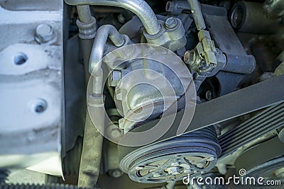 Detail of the engine fragment include ac compressor belt and pulley Stock Photo