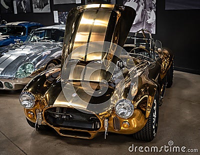 Detail of the exclusive AC Shelby Cobra 427 SC in gold color Editorial Stock Photo