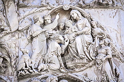 Detail of the facade of the Duomo of Orvieto, Italy. Marble bas-relief representing episodes of the bible. Adoration of the Magi Stock Photo