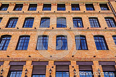 Detail of the facade of a modern loft-style office building, rebuilt from an old steam mill Editorial Stock Photo