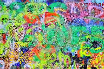 Detail of the famous John Lennon`s wall with graffiti in Prague Editorial Stock Photo