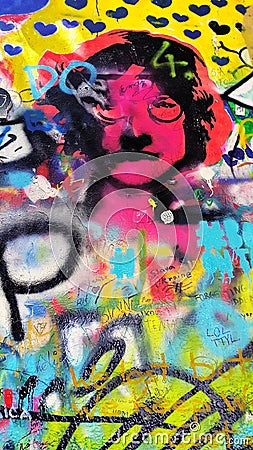 Detail of the famous John Lennon`s wall with graffiti in Prague Editorial Stock Photo