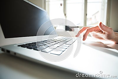 Detail of a female hand on the keyboard Stock Photo