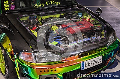 front wing of a tuned Honda Civic coupe with moody paint, spacers and clear bonnet Editorial Stock Photo