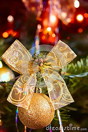 Detail gold ball and ribbon on christmas tree Stock Photo