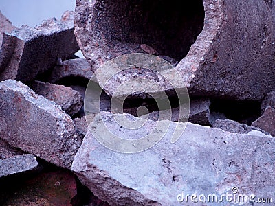 Detail gray broken concrete pipes, remnants of sewer repair, old concrete pipe, construction waste, landfill Stock Photo