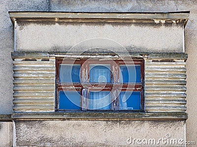 Detail of Grey Concrete Building With Blue Windows Stock Photo
