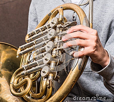 Detail of a hand on a french horn Stock Photo