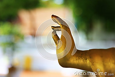 Detail hand ,statue of buddha, in a temple Stock Photo