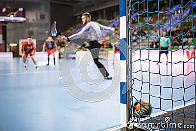 Detail of handball goal post with net and ball carrying to the goal Editorial Stock Photo