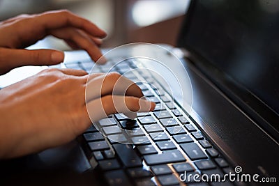 Detail of hands working on computer keyboard Stock Photo