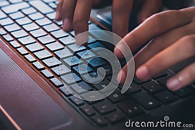 Detail of hands working on computer keyboard Stock Photo