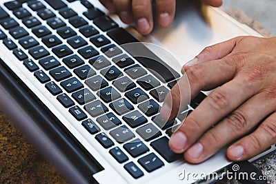 Detail of hands working on laptop Stock Photo