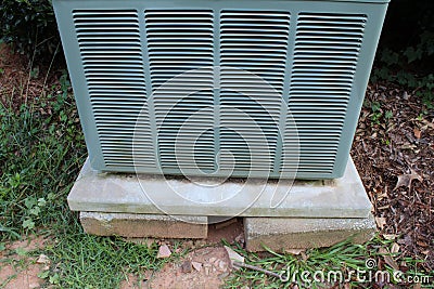 Detail of a heat pump on an unstable base Stock Photo