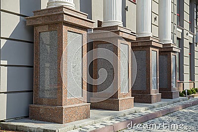 Detail of a house facade. Granite columns as decorative elements of the building Stock Photo