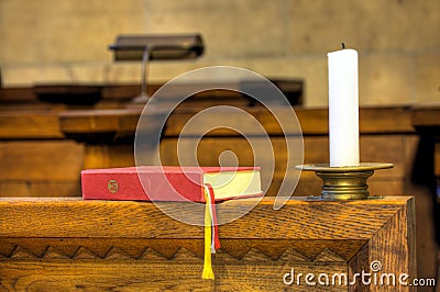 Detail of hymnal and candle Stock Photo