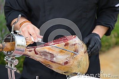 Detail of an Iberian ham cut by a professional. Concept pork, food, ham, iberian, spain, denomination of origin Stock Photo