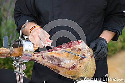 Detail of an Iberian ham cut by a professional. Concept pork, food, ham, iberian, spain, denomination of origin Stock Photo