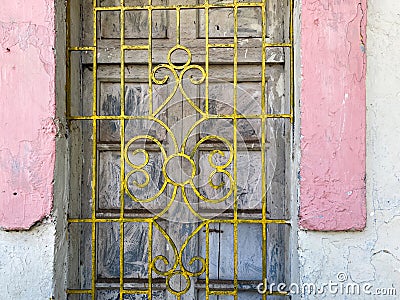 Detail of ironwork on the grille of a vintage window Stock Photo