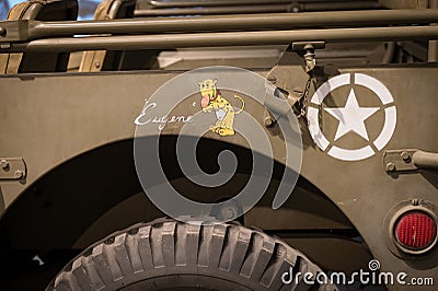 Detail of the Jeep Willys MB nicknamed "Eugene the Jeep" with the drawing of the mascot. Editorial Stock Photo