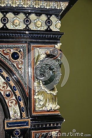 Marble face of the young lady on the retro chimney in the historical interior Editorial Stock Photo