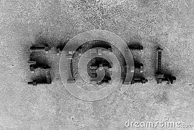 Letter word is steel by old and rusty nut on dirty ground Stock Photo